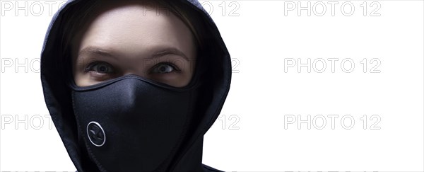 Portrait of a girl in a protective mask. The concept of the fight against the epidemic.