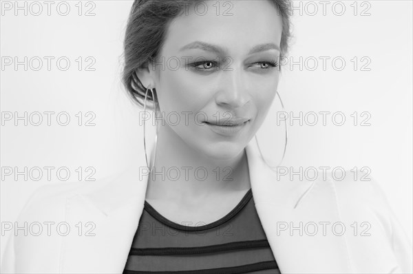 Portrait of a beautiful girl with a defiant make-up. White background. Beauty concept. High quality