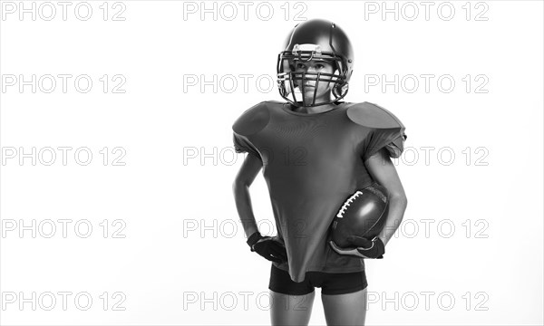 Black and white images of a sports girl in the uniform of an American football team player. Sports concept. White background.