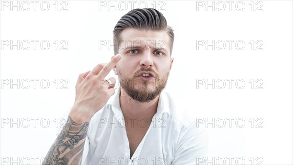 Stylish bearded man shows middle finger to the camera. The concept of failure