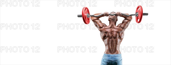 Athlete posing on a white background in jeans with a barbell in his hands. Back view. Fitness