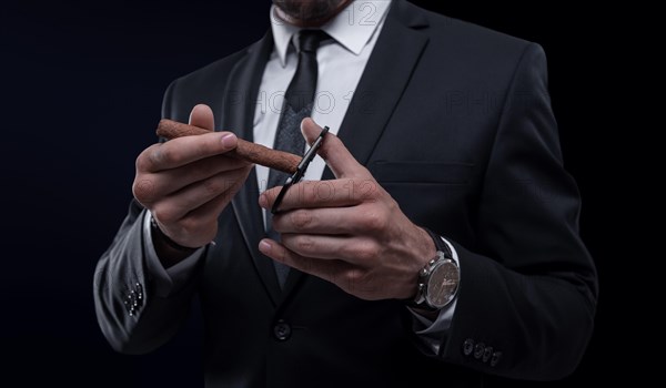 Image of an adult stylish man in a suit with a cigar. Cigar clubs concept.