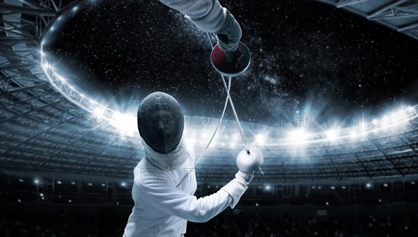 Portrait of two fencers against the backdrop of a sports arena. The concept of fencing. Duel.