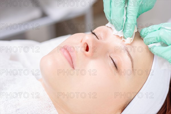Beautiful girl gets face peeling. Skin health concept. Beauty salons.