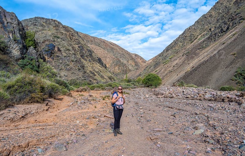 Mountaineer in a canyon with a dry stream bed - Photo12-imageBROKER ...
