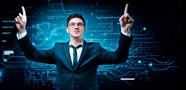 Confident man is standing in a business suit on the background of a stock exchange hologram. He is celebrating a victory. Stock broker and trader. Business investment.