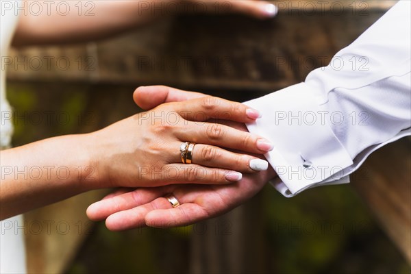 Detail of hands of bride and groom with rings at a wedding