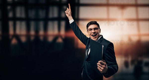 Portrait of a man in a business suit. He is standing at the airport with his hands up. VIP transportation. Private airlines. Charter flights.