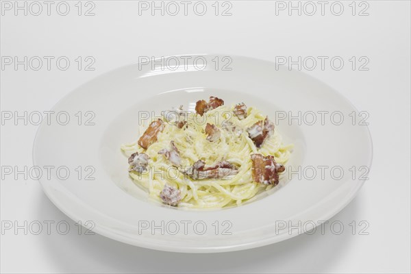 Gourmet carbonara pasta on a white background. Top view.