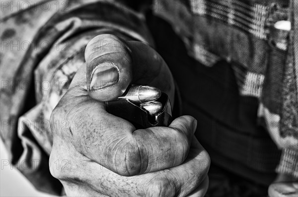 The fighter prepares a clip with bullets before the next fight.