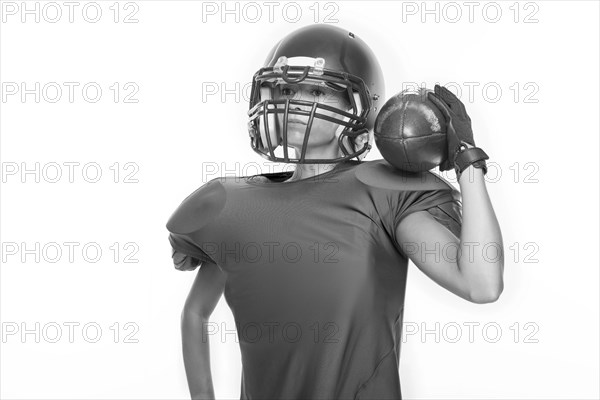 Black and white images of a sports girl in the uniform of an American football team player. Sports concept. White background.