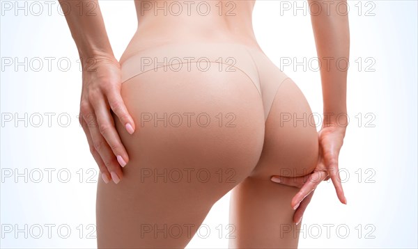 Image of female buttocks. Body care. Diet. Proper nutrition. Calorie counting. Healthy lifestyle. Anti-cellulite.