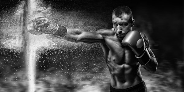 Professional boxer breaks the barrier with a glove. Dust and debris spilled over. 3d rendering. Sports concept.