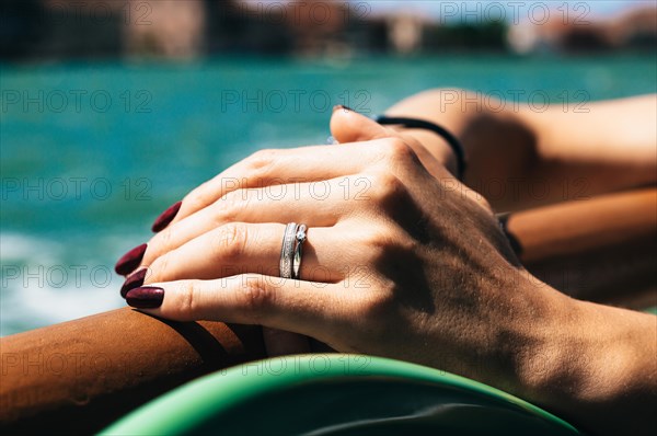 Hand of a girl with a wedding ring. The concept of visiting weddings