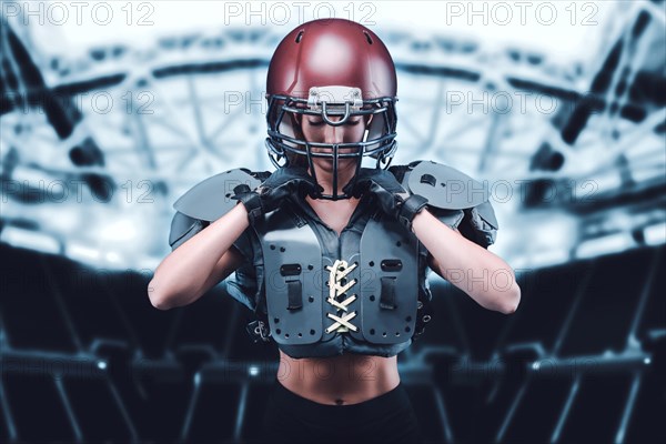 Iimage of a girl at the stadium in the uniform of an American football team player. Sports concept.