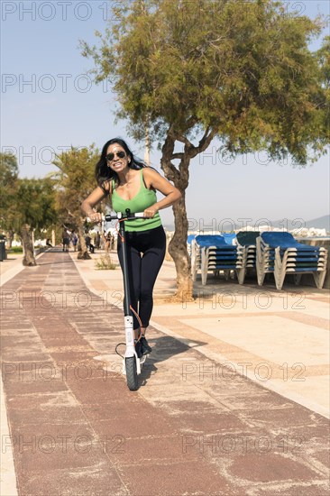 Woman riding electric scooter