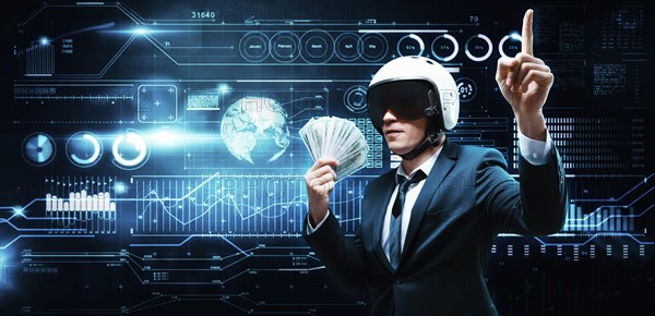 Portrait of a businessman in a suit and aviator helmet. He made a fan of a pack of hundred-dollar bills. Business concept.