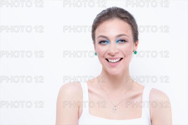 Portrait of a beautiful girl with a defiant make-up. White background. Beauty concept. High quality