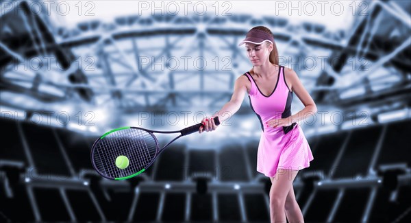 Portrait of a tennis player in a pink dress against the background of a sports arena.