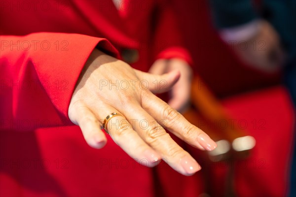 A show-off bride with her ring at a beautiful wedding