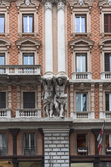 Atlases on a historic house facade