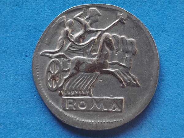 Ancient roman coin with horses and biga