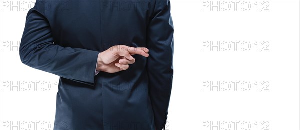 Image of a man's hands with crossed fingers on a white background. Back view. Business concept.