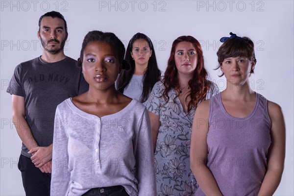 Multiethnic group of people looking serious on camera. Concept feminism