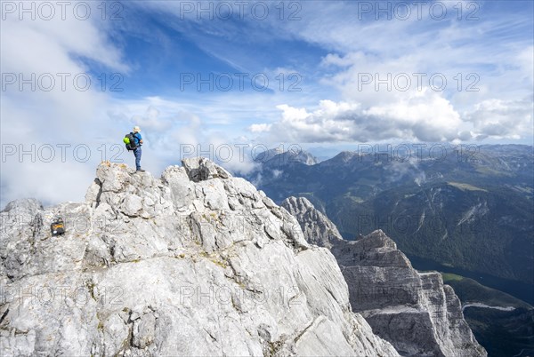 Mountaineer on a narrow rocky ridge