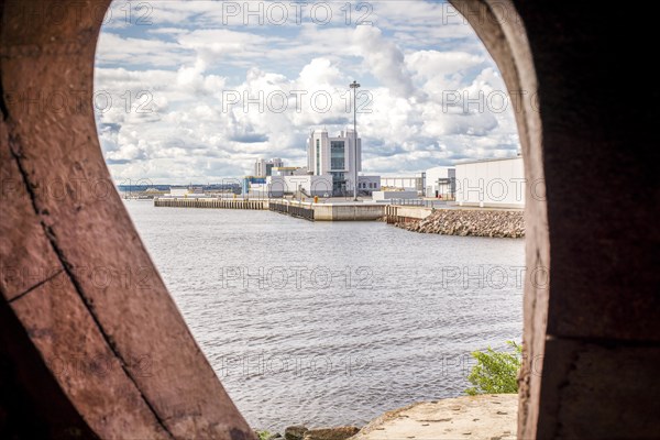 Image of an oval window overlooking Fort Constantine