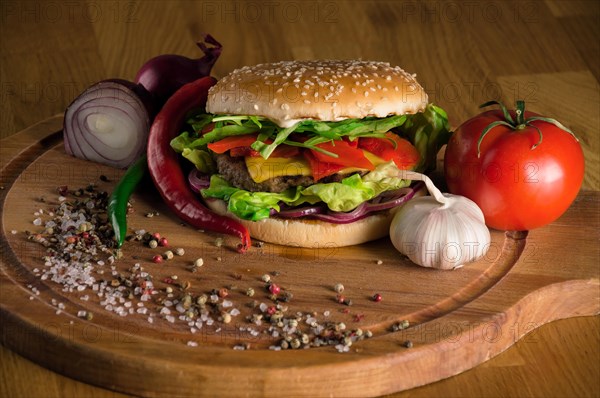 Delicious cheeseburger with fried beef chops