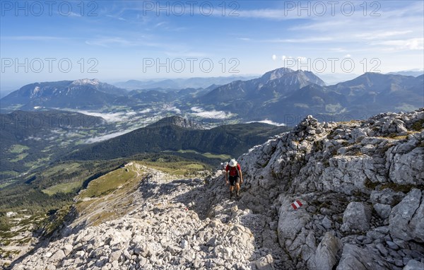 Mountaineer on hiking trail to Watzmann Hocheck summit