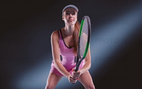 Image of a tennis player with a racket. Sports concept.