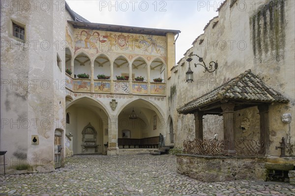 Depiction of a jousting tournament above the arcade