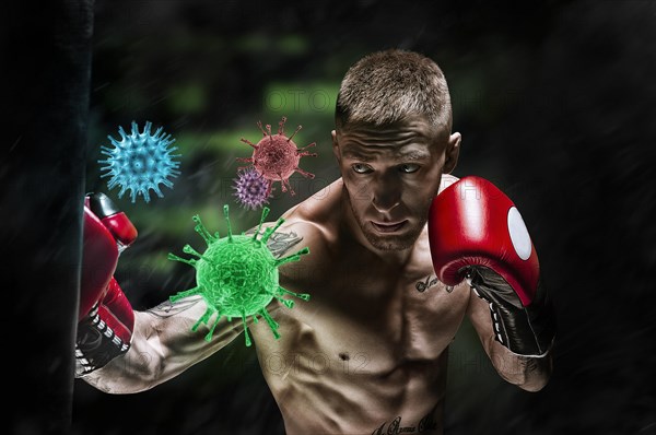 Boxer hits the bag and the coronavirus flies out. Sport vs epidemic. Healthy lifestyle concept.
