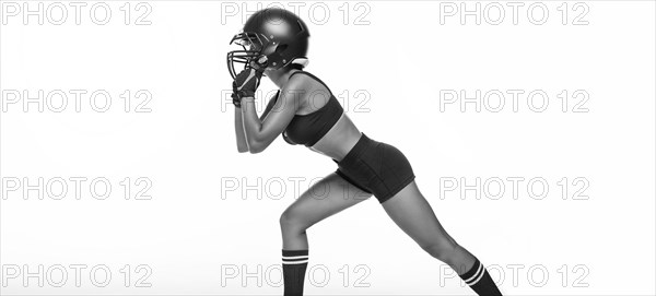 Black and white images of a sports girl in the uniform of an American football team player. Sports concept. White background.