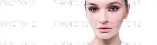 Portrait of a female young face with perfect makeup. The concept of plastic surgery