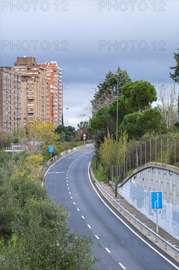 Cityscape with a highway without traffic in the city of Madrid in Spain
