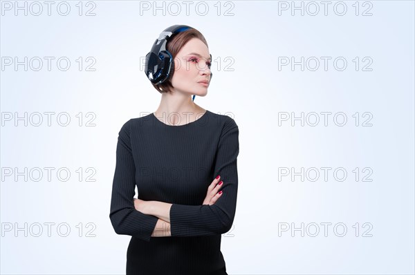 Portrait of a woman in professional headphones. White background. Dj concept.