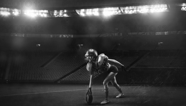 Image of a girl in the uniform of an American football team player preparing to play the ball at the stadium. Sports concept.