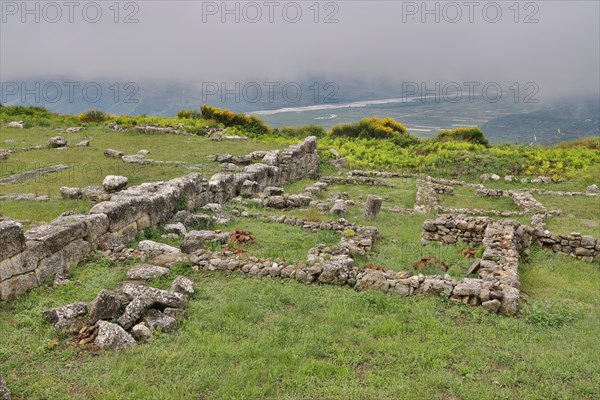 Remains of the Illyrian hilltop settlement of Byllis and view of the VJosa valley