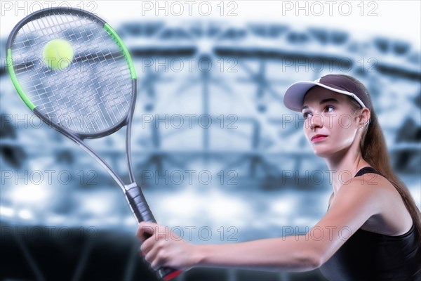 Portrait of a tennis player in a pink dress against the background of a sports arena.