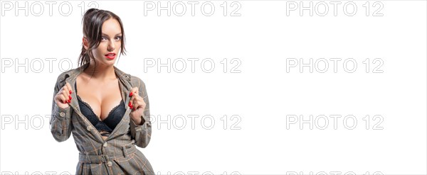 Sexy girl posing in the studio with an open neckline. Beautiful female breasts. Lingerie concept.