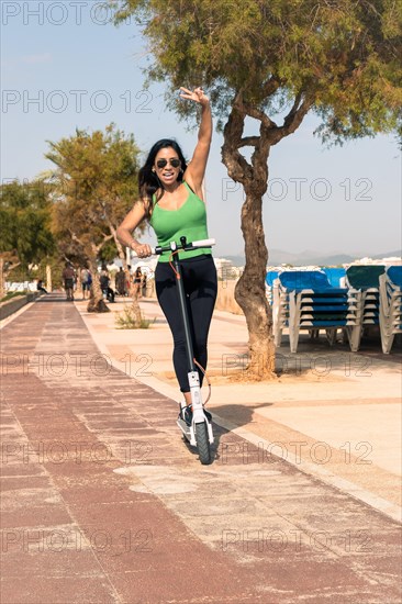 Woman riding electric scooter