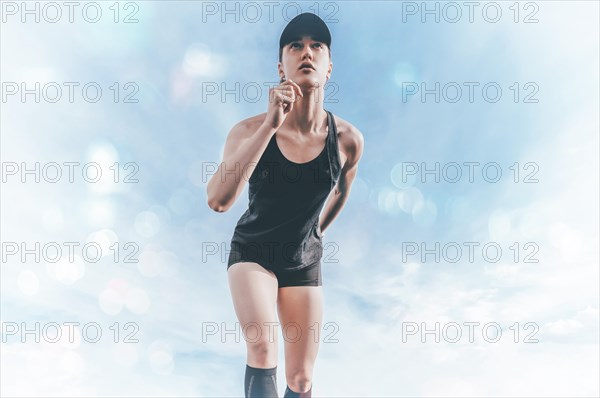 Professional runner stands on the track and prepares for the start of the race. Sports concept.
