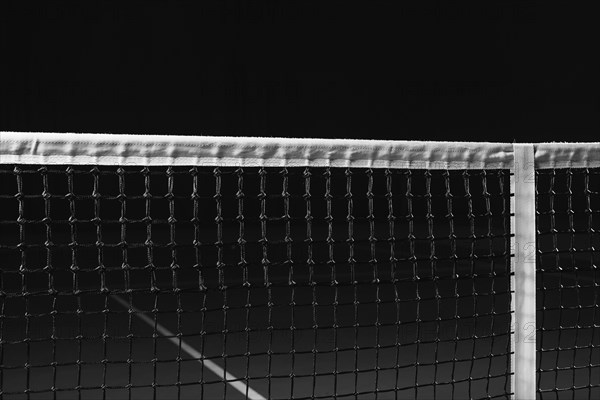 Image of a tennis court with a stretched net. Sports concept.