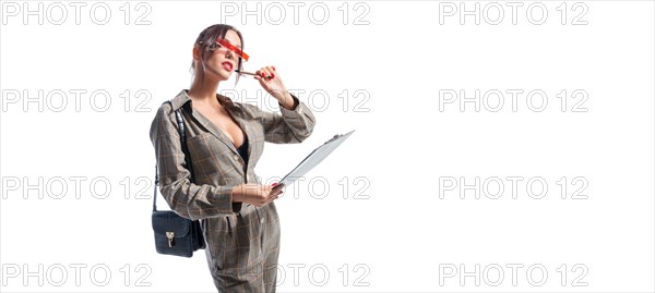 Charming girl makes notes on the tablet. She is happy and smiling. Business style. Interview concept.