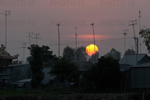 Sunset behind roofs and old television aerials