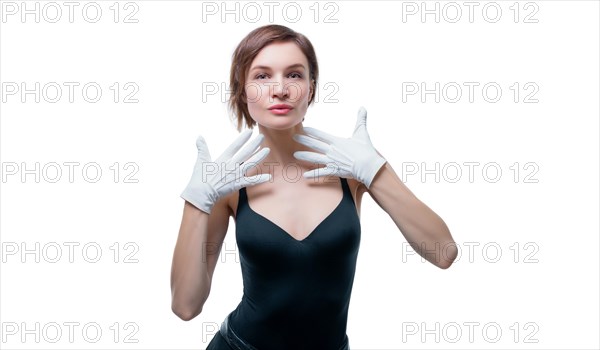 Surprised beautiful young woman in white gloves posing in the studio on a white background