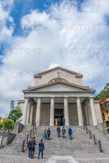 Guests at a wedding in the church of Our Lady of the Assumption in the coastal town of Mutriku